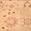 Traditional floral rug with muted tones and worn vintage aesthetic.