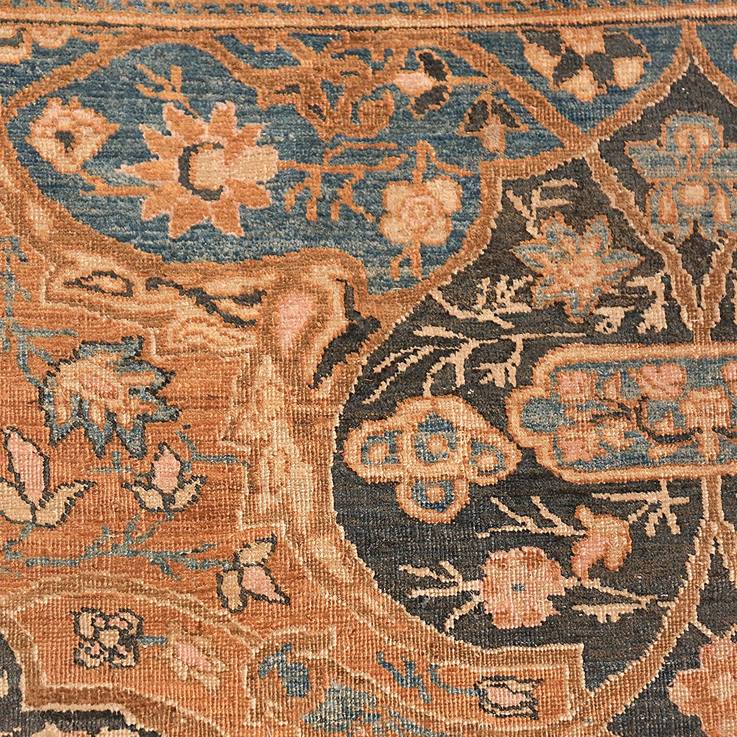 Exquisite hand-woven rug showcases intricate floral and geometric motifs.