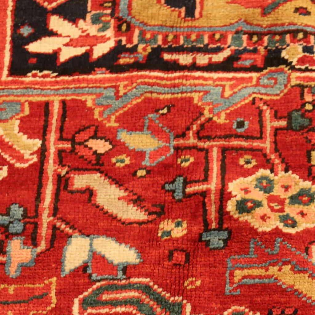 Intricate and symmetrical design of a well-preserved Persian carpet.