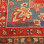 Vibrantly colored, intricately patterned rug showcases exceptional craftsmanship and design.