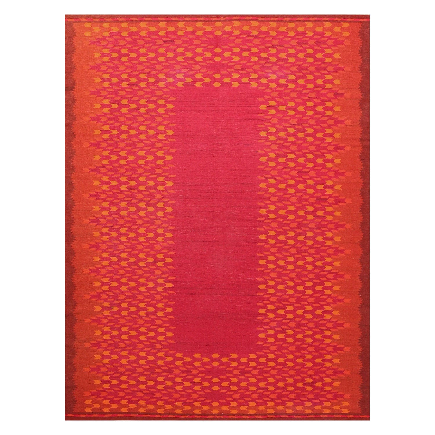 Vibrant red and golden yellow area rug with bold pattern.