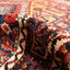Folds of a plush, intricate Persian carpet showcase its artisanal beauty.
