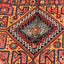 Exquisite, handwoven carpet with vibrant colors and intricate symmetrical patterns.