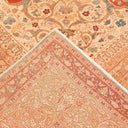 High-quality handwoven carpet with intricate floral design in vibrant colors.
