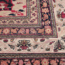 Exquisite handmade rug with intricate floral and geometric motifs