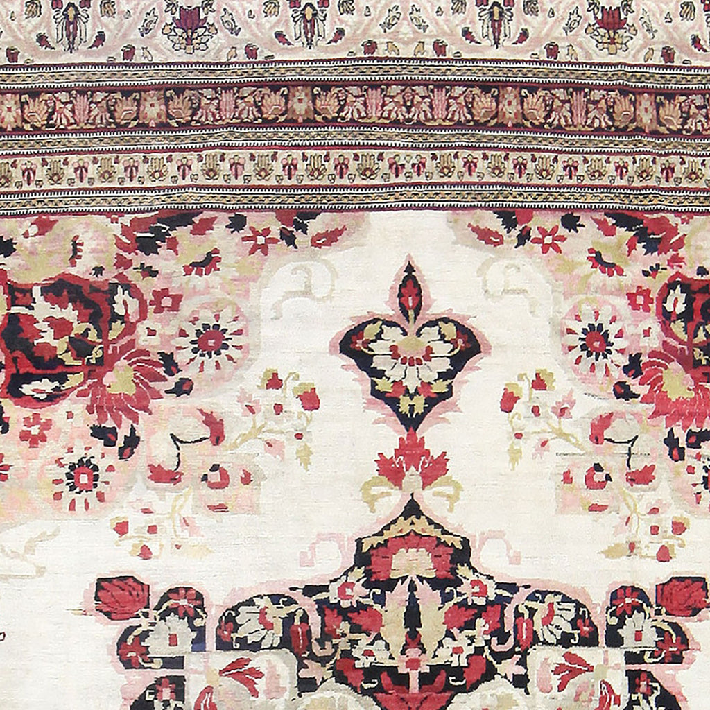 Ornate Persian or Oriental rug features intricate floral motifs and vibrant colors.