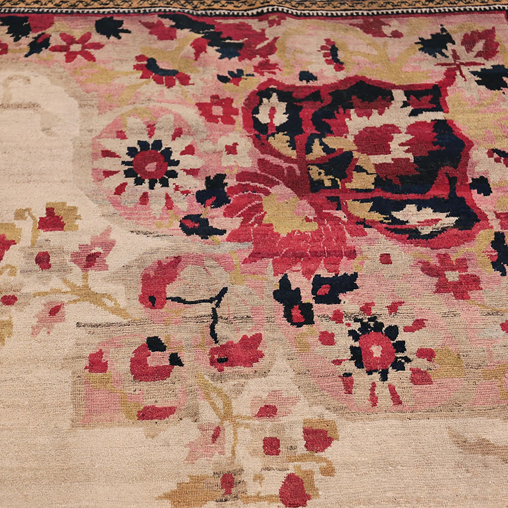 Intricate handcrafted rug showcases vibrant floral design in rich hues.