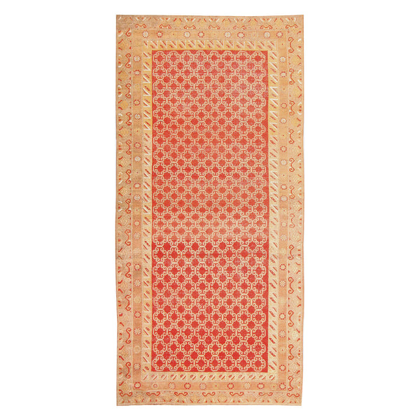 Intricately designed rectangular area rug featuring rich red color and floral motifs.