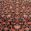 Close-up of a luxurious, handmade carpet with intricate floral design.