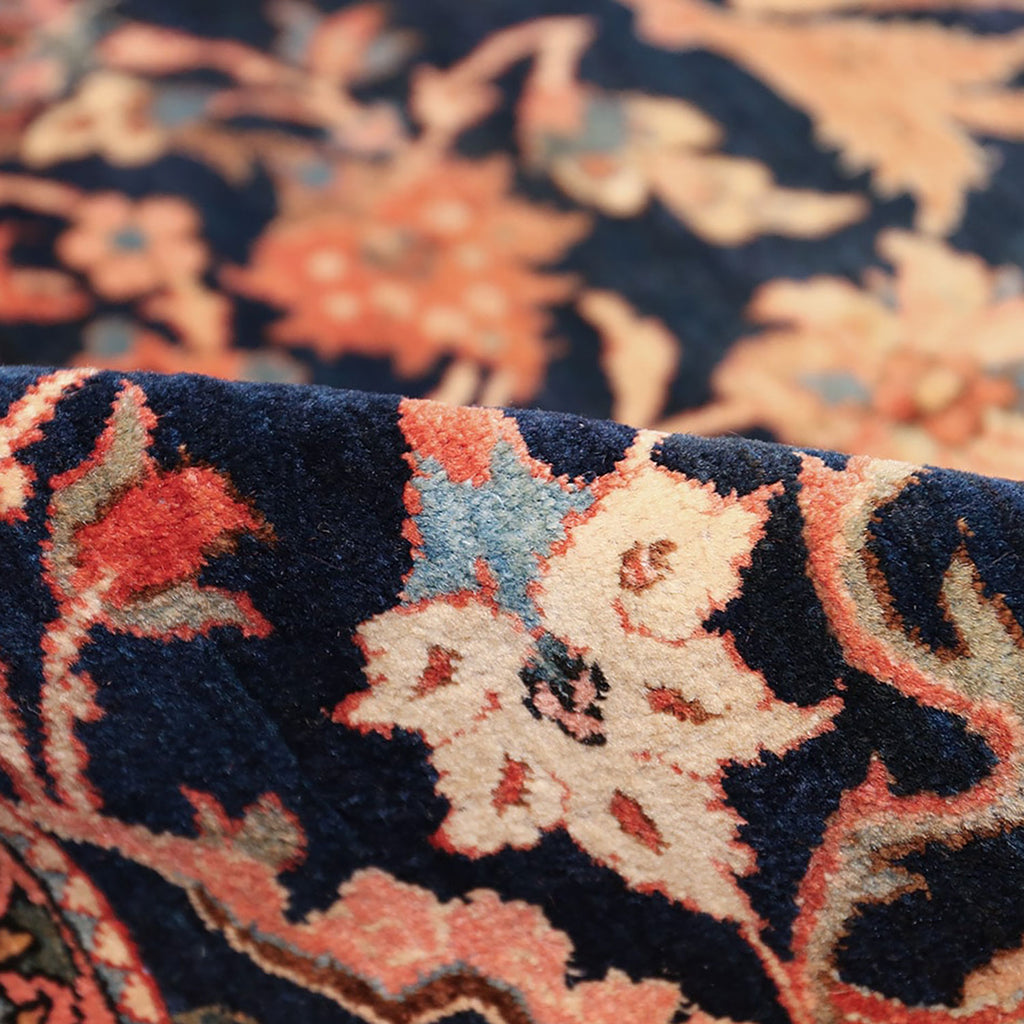 Intricate and vibrant rug fabric showcases rich Persian-inspired designs.