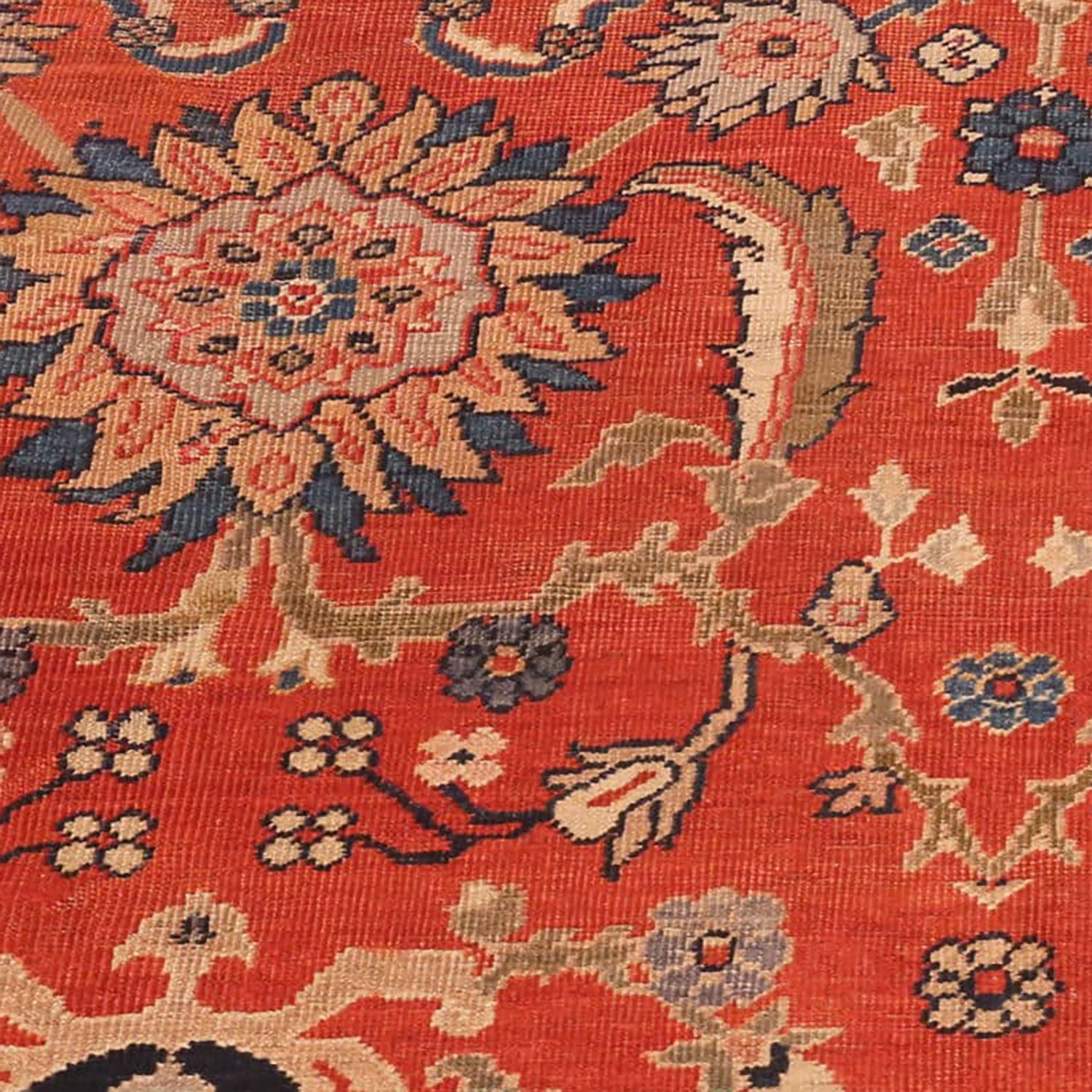 Intricate floral design in vibrant colors on a high-quality rug.