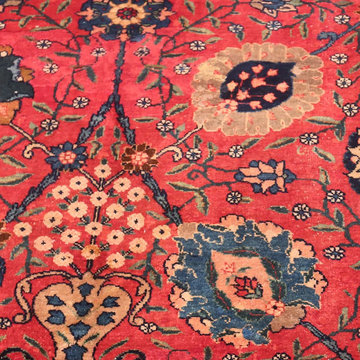 Intricate traditional floral rug with vibrant colors and timeless design.