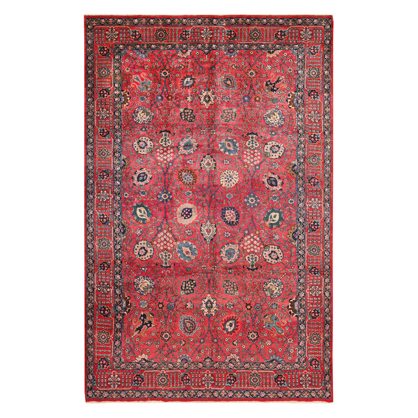 Intricately designed handwoven rug with rich red field and floral motifs.