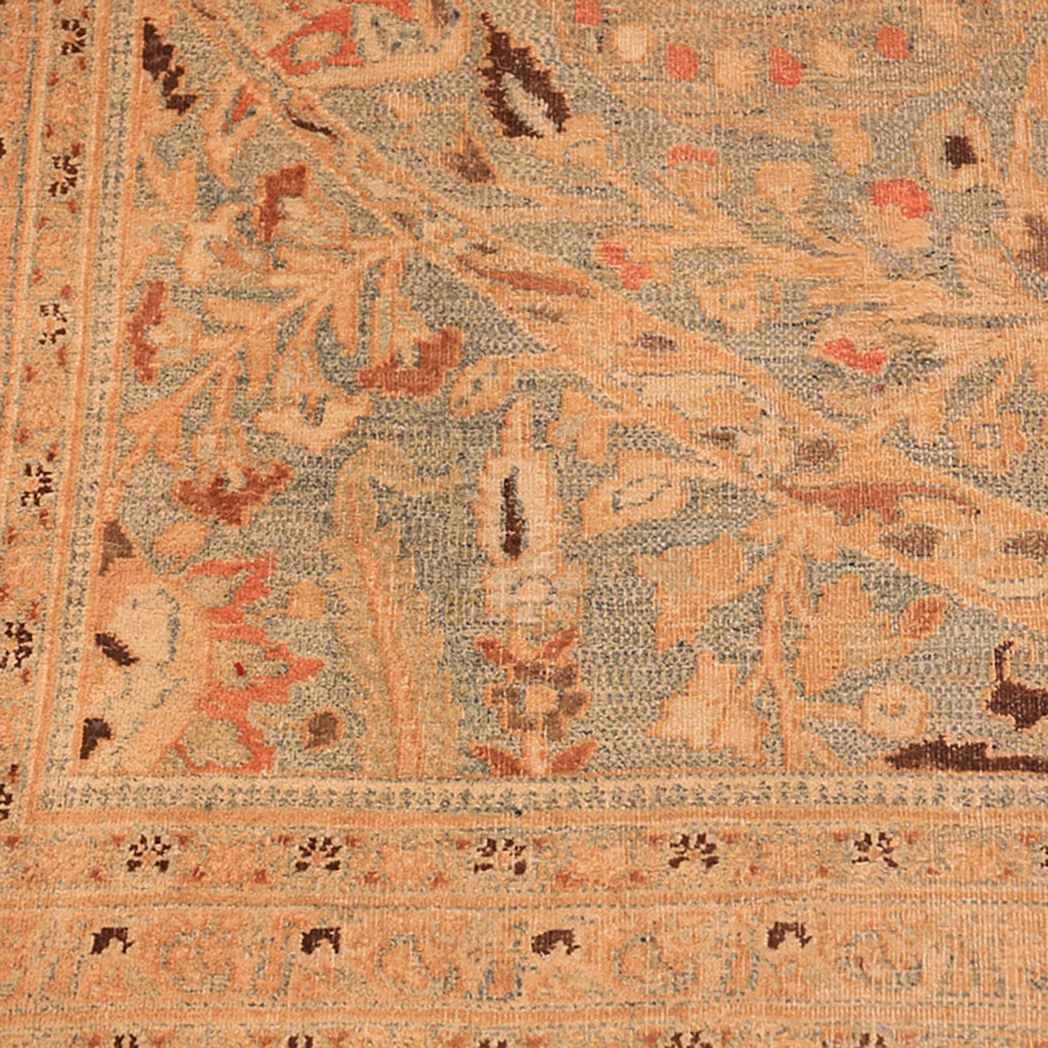 Intricately patterned rug with floral motifs, showcasing skilled craftsmanship.