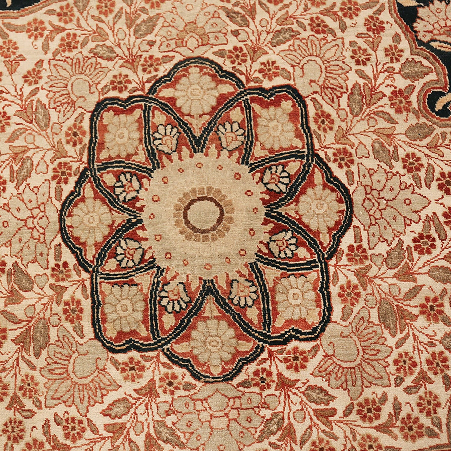 Intricately woven Persian-style carpet with rich floral patterns and symmetrical design.