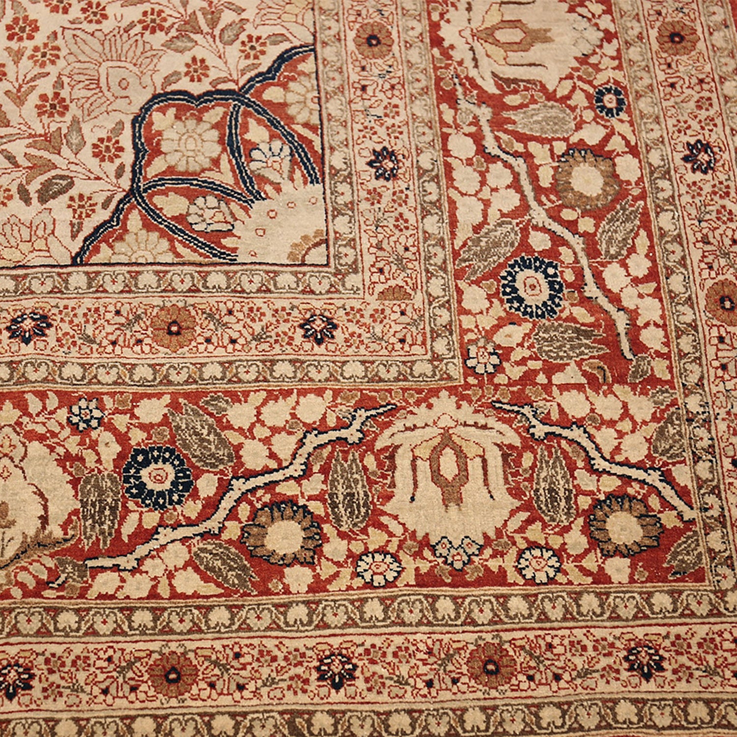 Exquisite handwoven Persian-inspired rug adorned with intricate floral patterns.