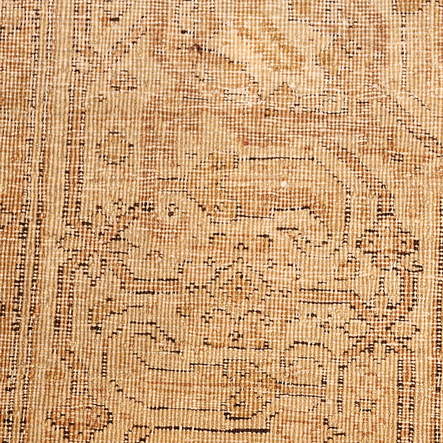 Close-up of intricate woven rug or tapestry with floral motifs.