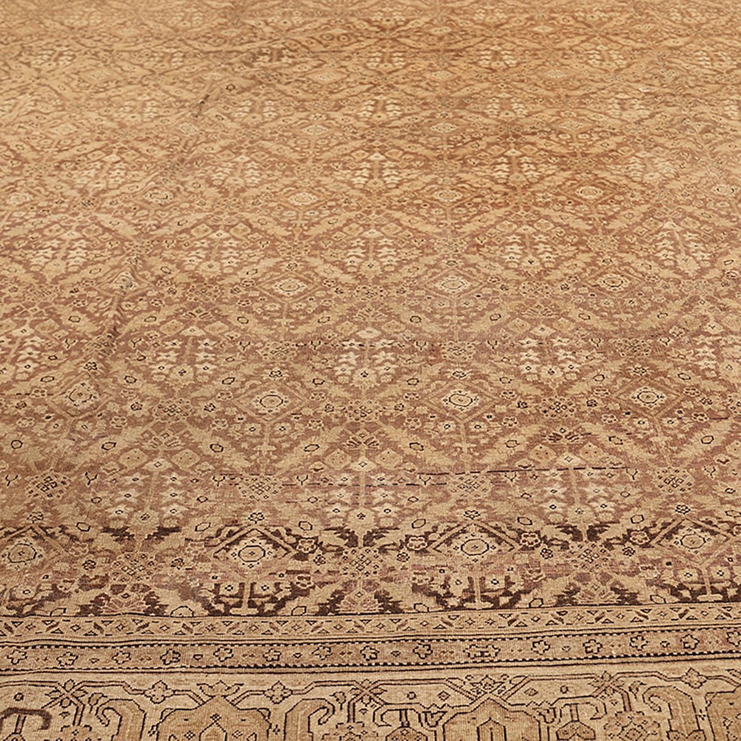 Close-up of a meticulously crafted, symmetrical rug with intricate patterns
