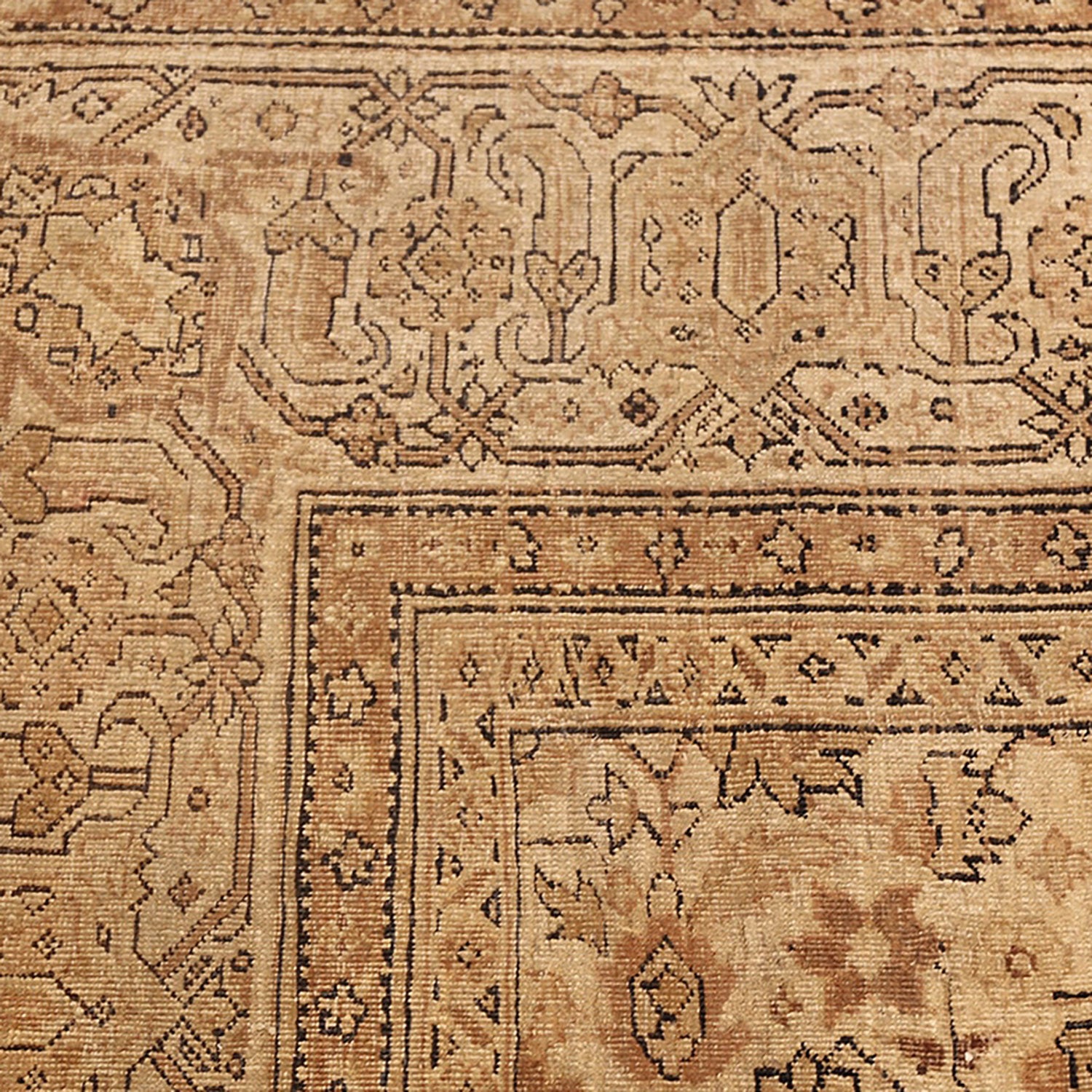 An intricate, handmade rug with traditional motifs in earthy tones.