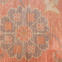 Visually intricate fabric with symmetrical, abstract design and pixelated effect.