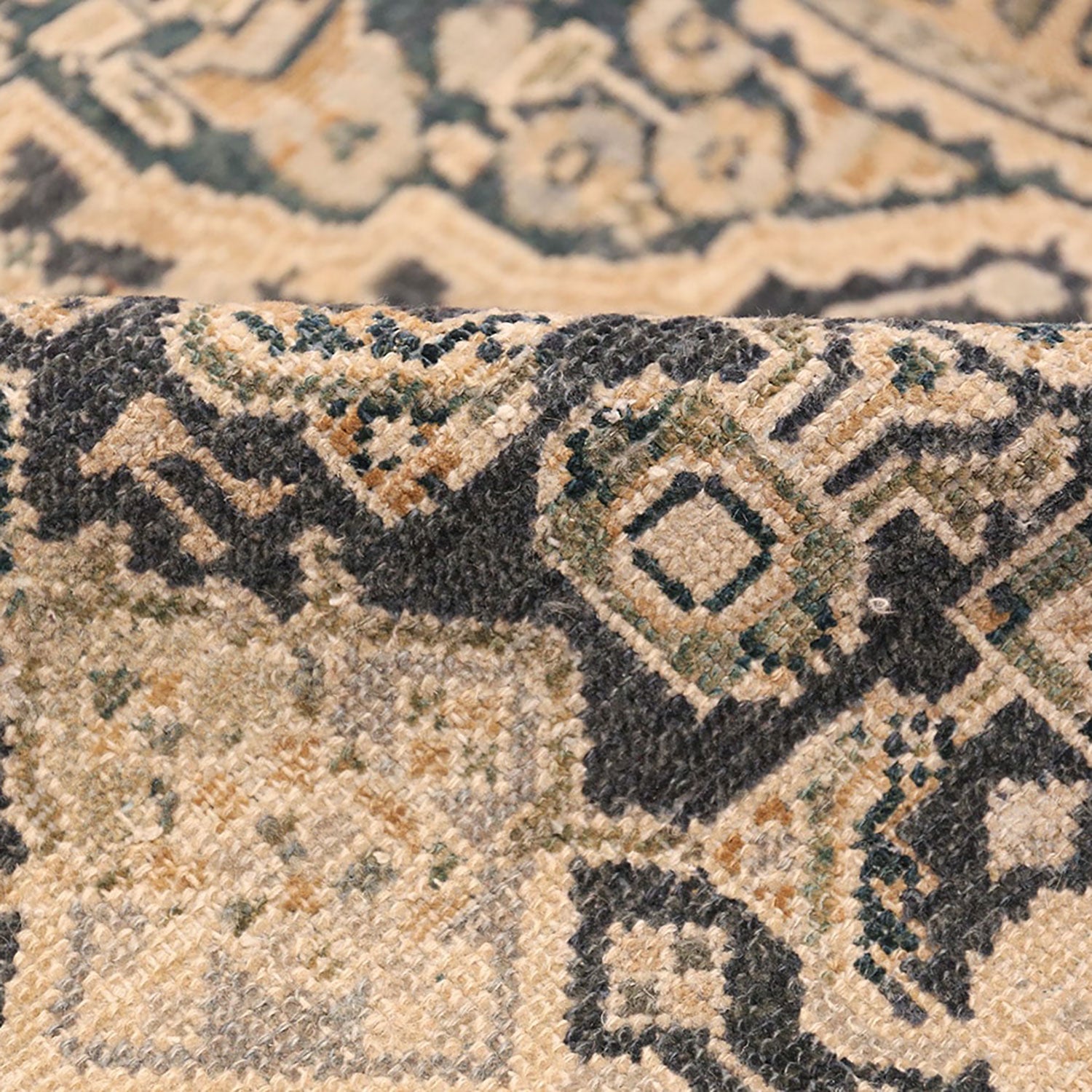 Intricately woven carpet exhibits rich colors and traditional patterns.