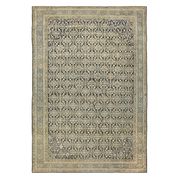 Intricately designed traditional rug with floral motifs and geometric shapes.