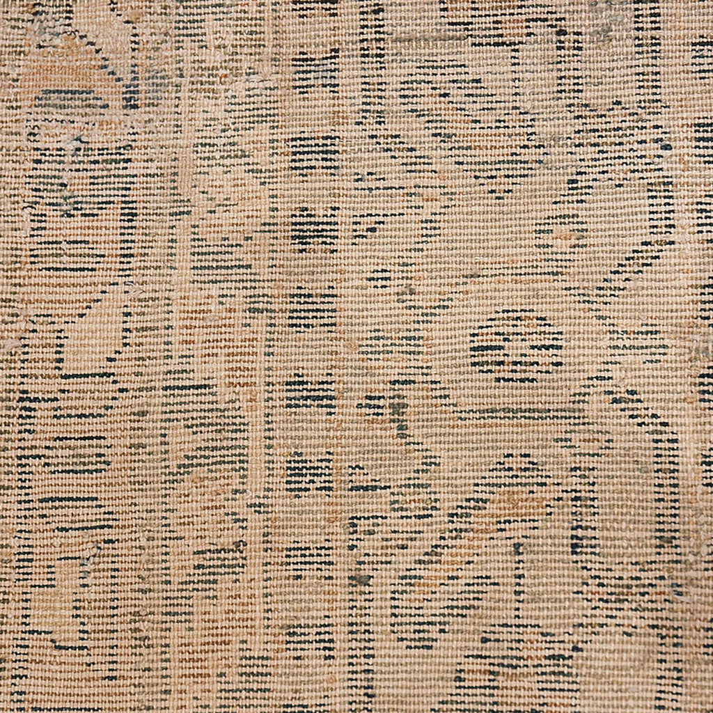 Intricate tribal-inspired tapestry showcases symmetrical dark geometric patterns on beige fabric.