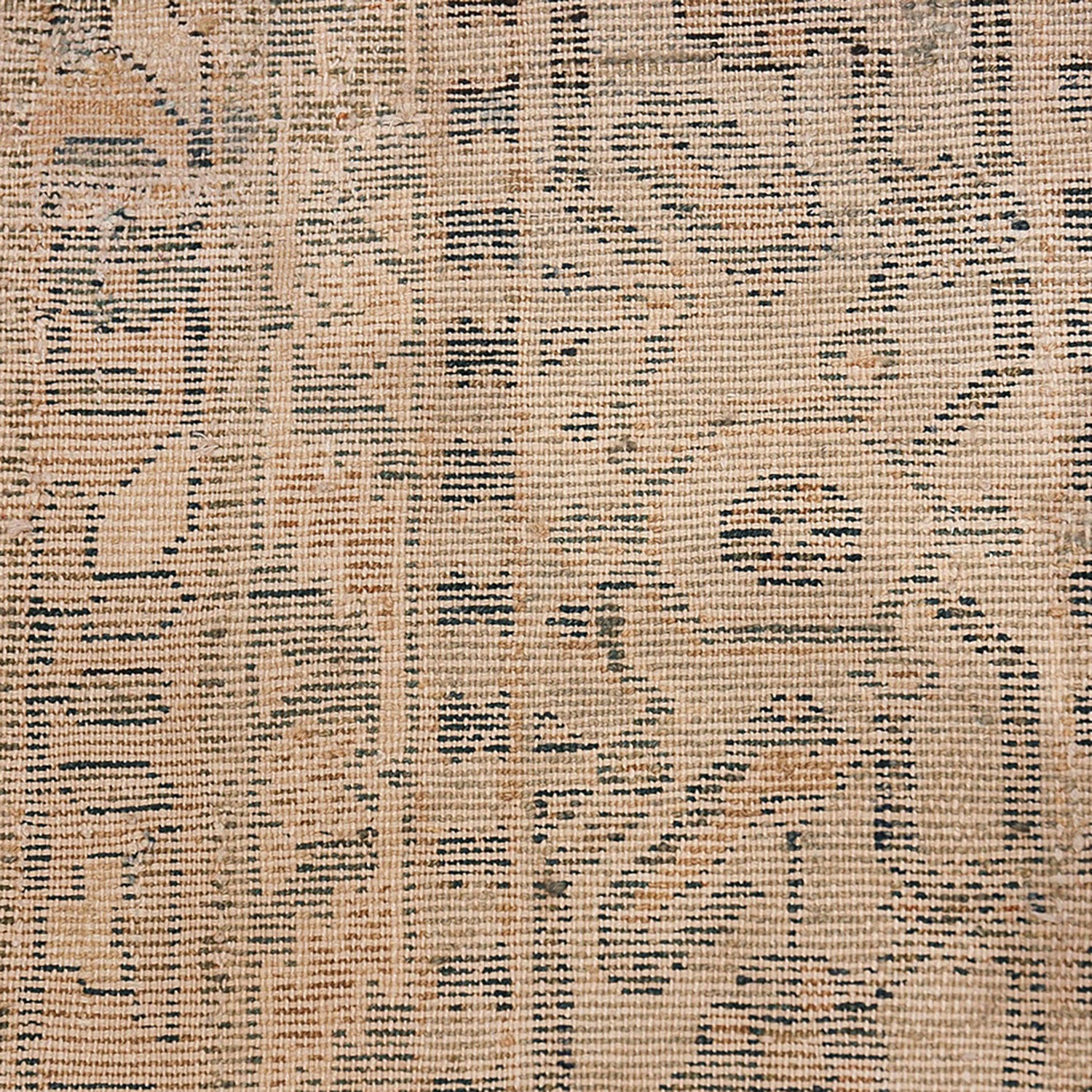 Intricate tribal-inspired tapestry showcases symmetrical dark geometric patterns on beige fabric.