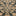 Close-up of a intricate patterned carpet with geometric shapes.