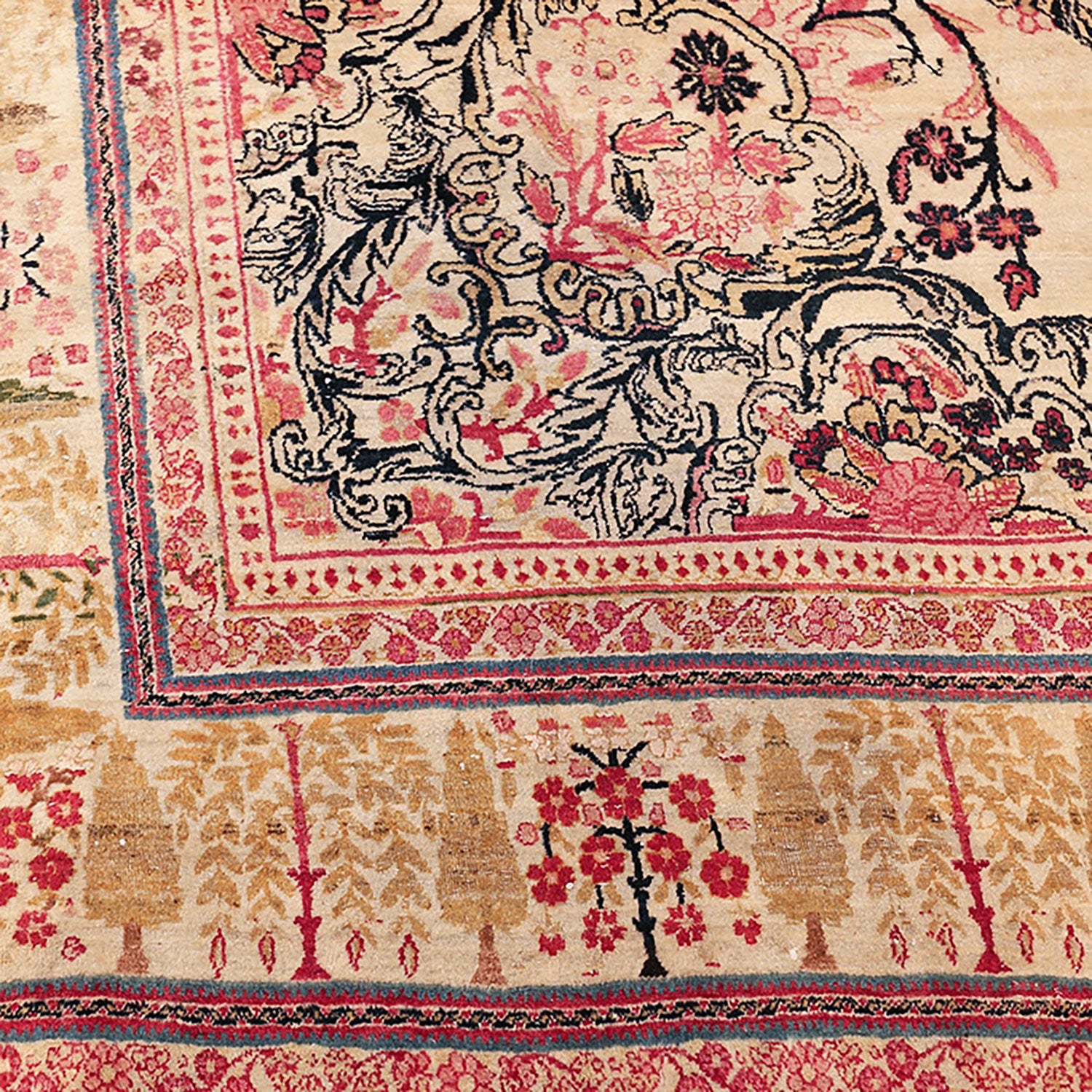 Close-up of a vintage Persian-style rug with floral motifs.