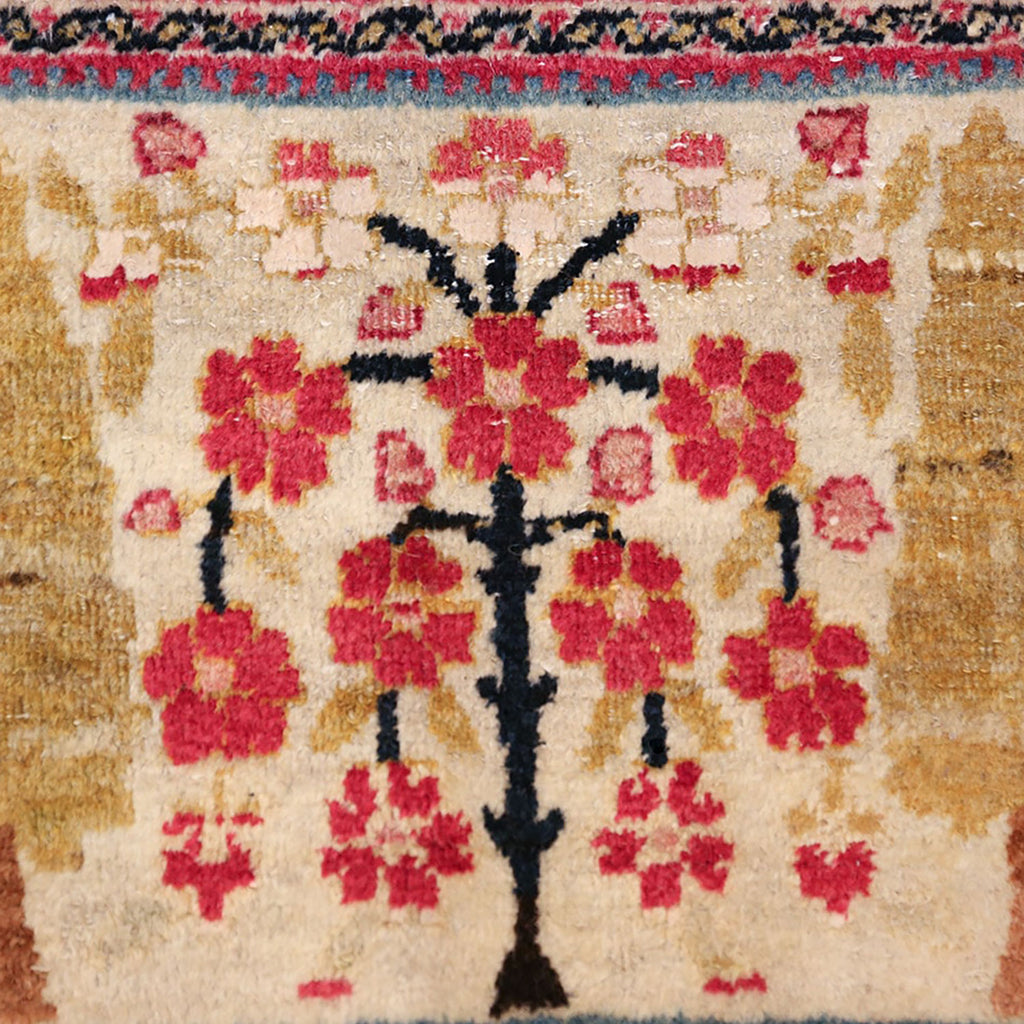 Close-up detail of a floral patterned rug with vibrant colors.