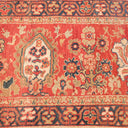 Intricate traditional rug showcasing symmetrical floral and geometric patterns.