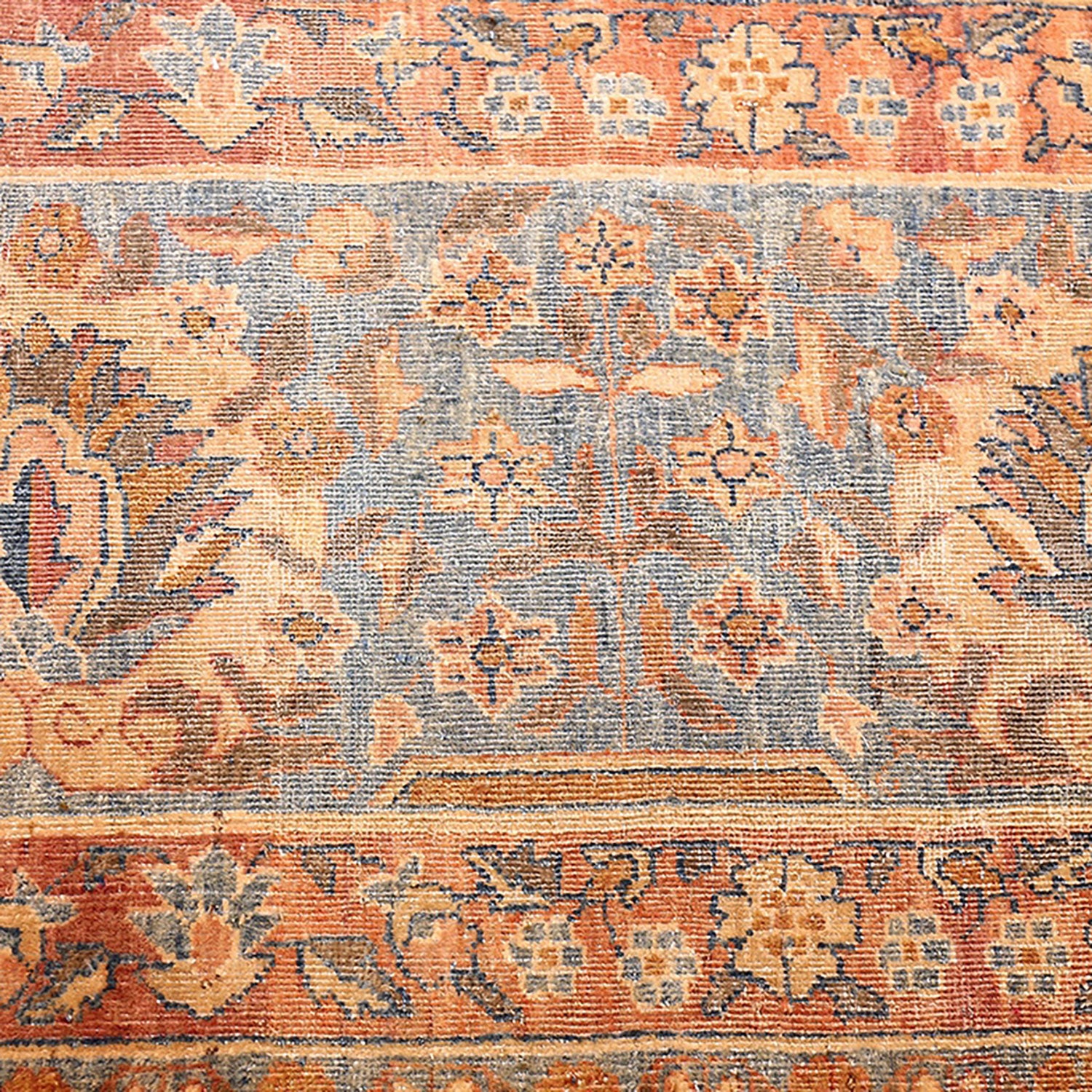Close-up of an intricate, traditional rug with vibrant colors.