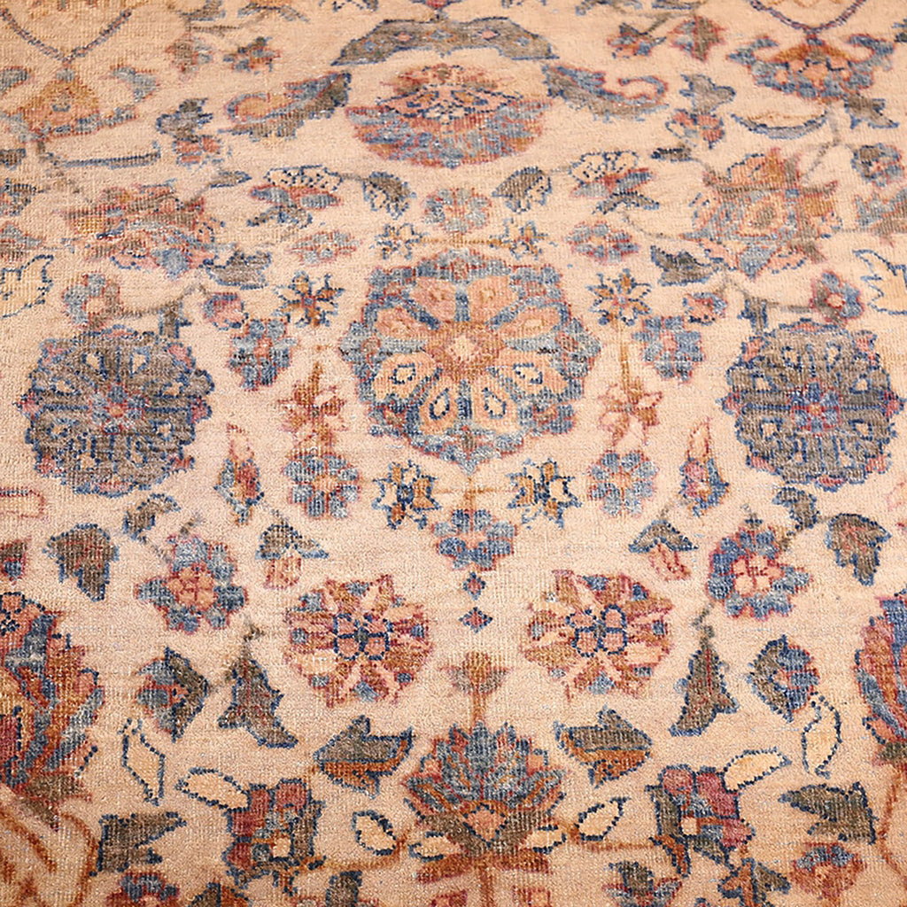 Intricate, symmetrical rug showcases exquisite craftsmanship with muted, traditional design.