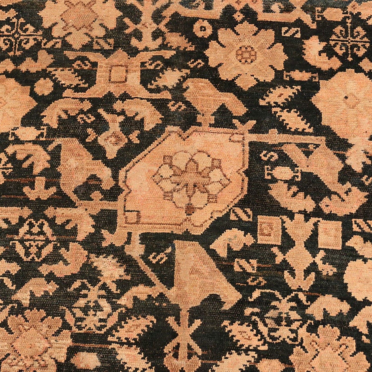 Intricately woven rug showcases traditional patterns with dark and light tones.