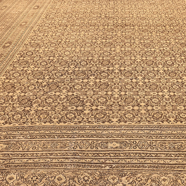 Exquisite traditional carpet with intricate floral and geometric patterns.