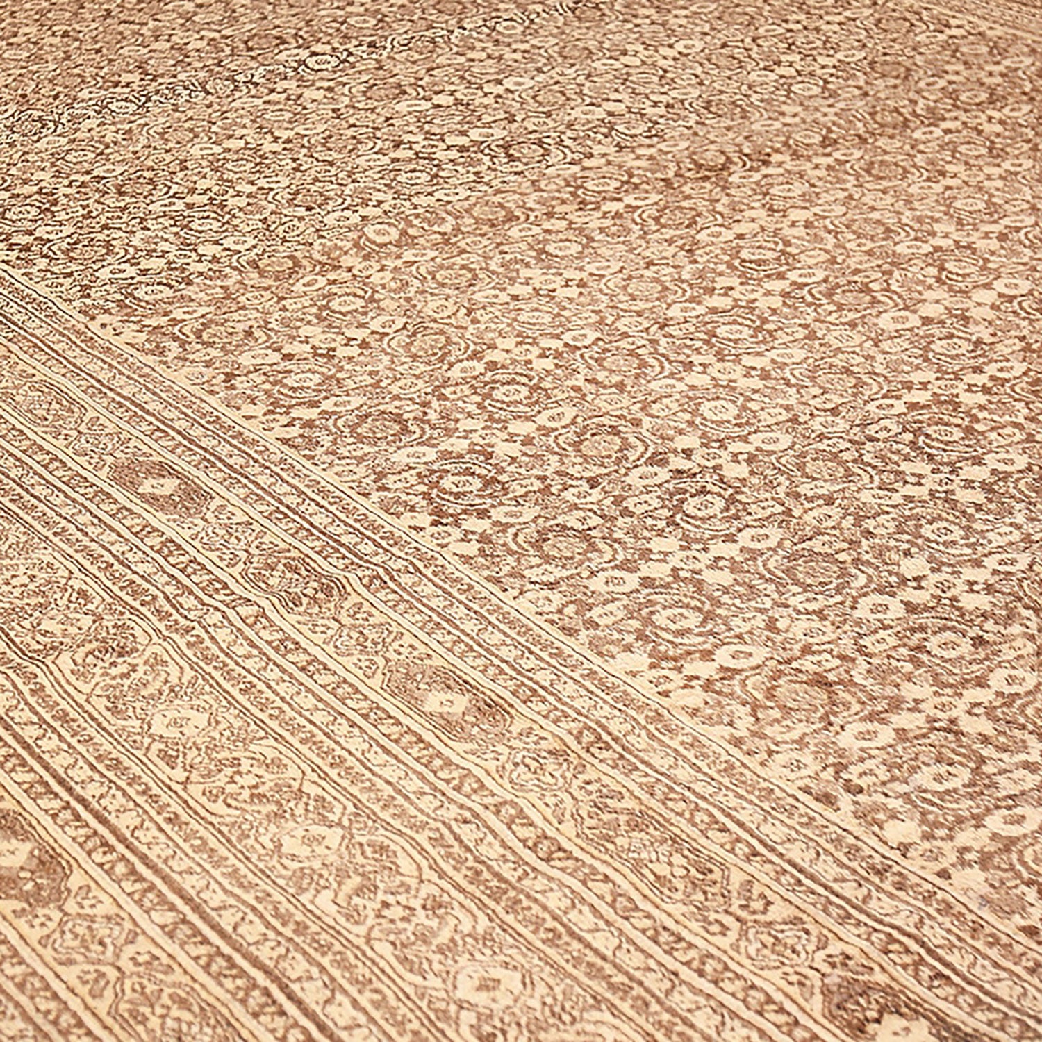 An intricately patterned, high-quality carpet with elegant floral motifs.