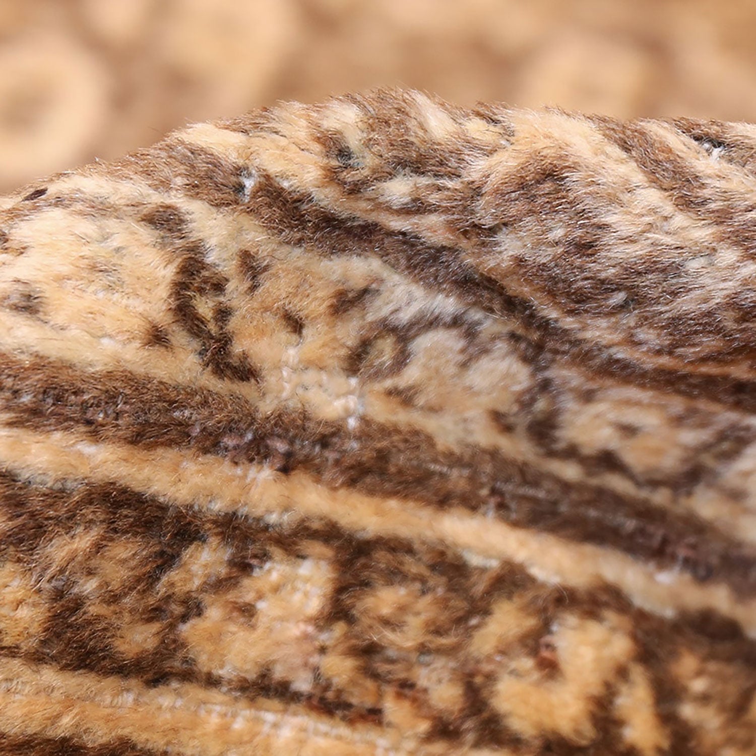 Close-up of a tiger's fur showcasing its distinctive orange-brown stripes.