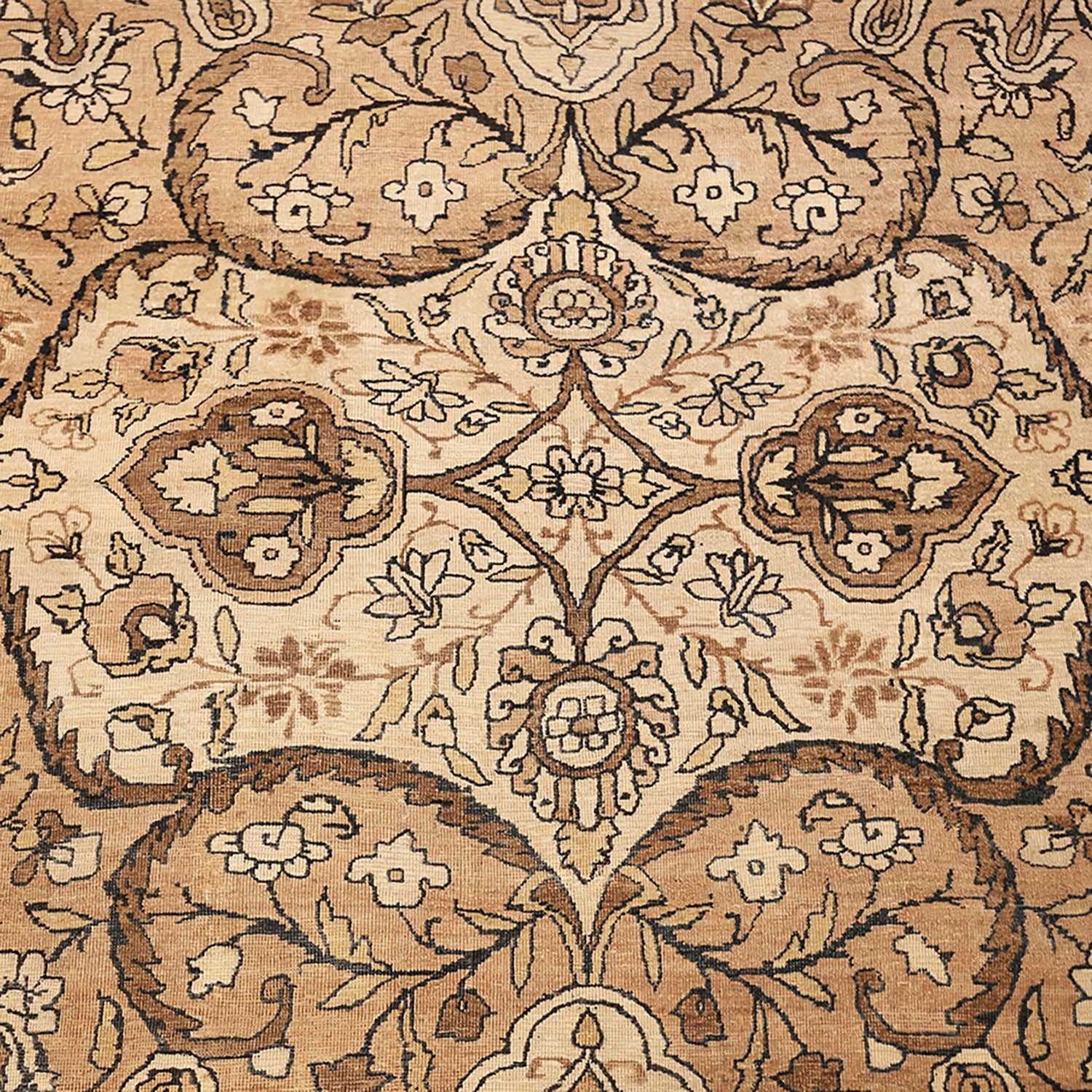 Close-up of a symmetrical floral and vegetal patterned fabric or carpet.