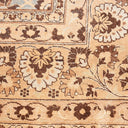 Close-up view of a patterned rug with intricate floral motifs.