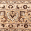 Detailed close-up of a traditional, ornamental carpet with repetitive patterns.