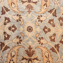 Close-up of intricate and symmetrical floral pattern on textured fabric.