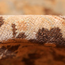 Close-up view of textured fabric with striped pattern and fibers.
