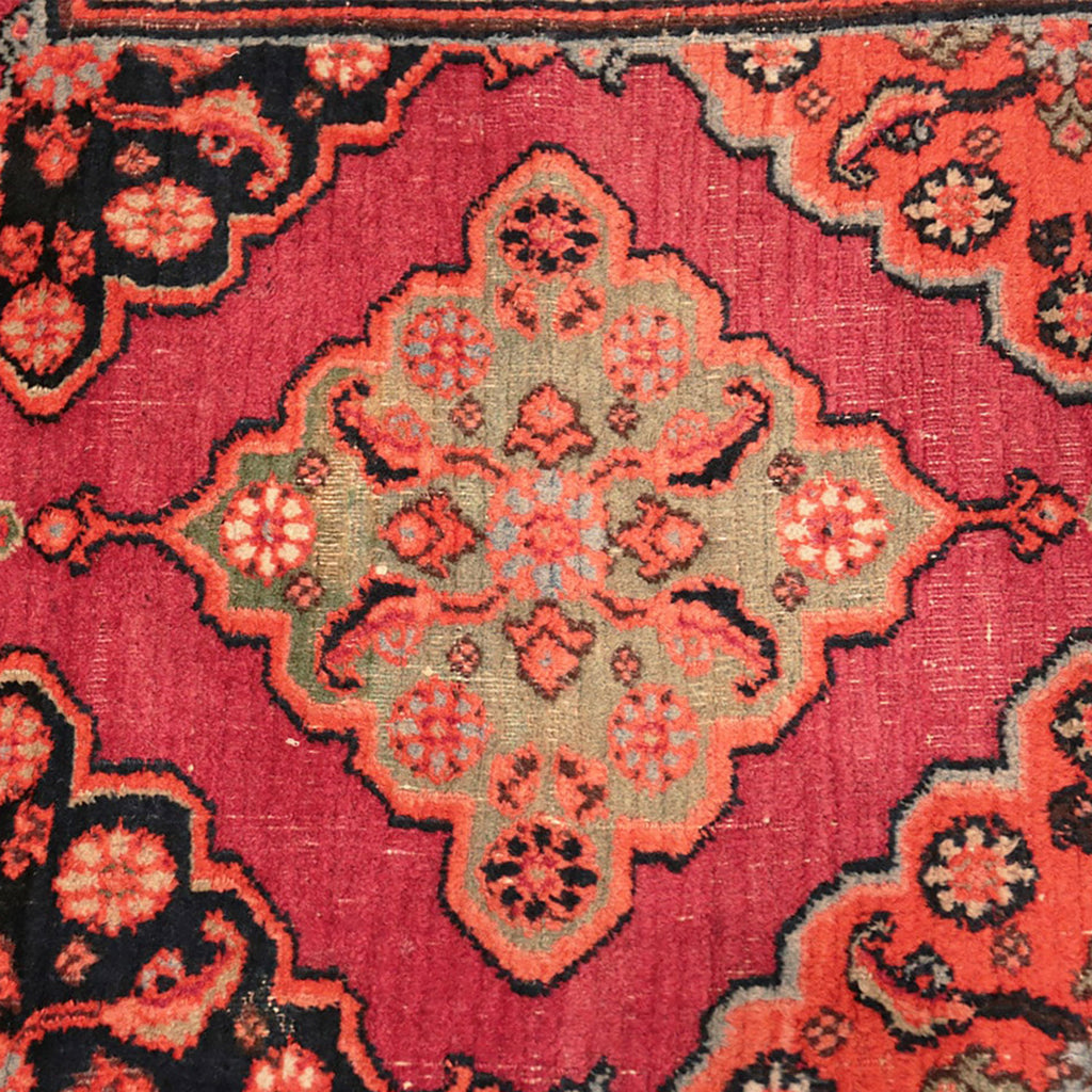 Close-up of a traditional Oriental rug with intricate floral patterns