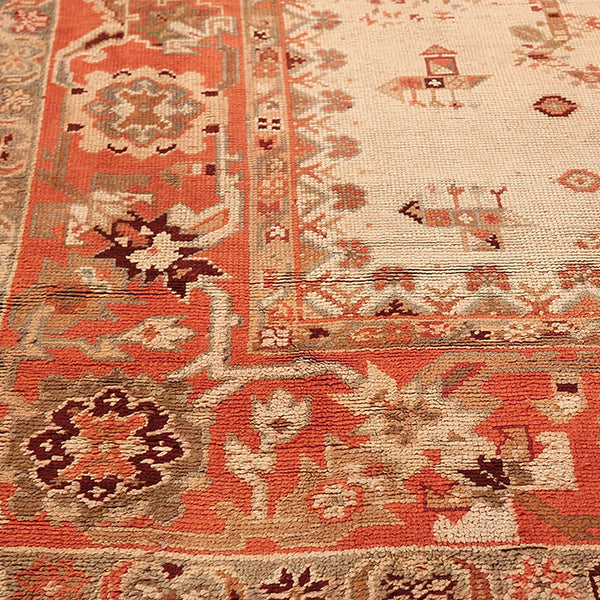 An intricately designed, high-quality Persian/Oriental rug in warm earth tones.