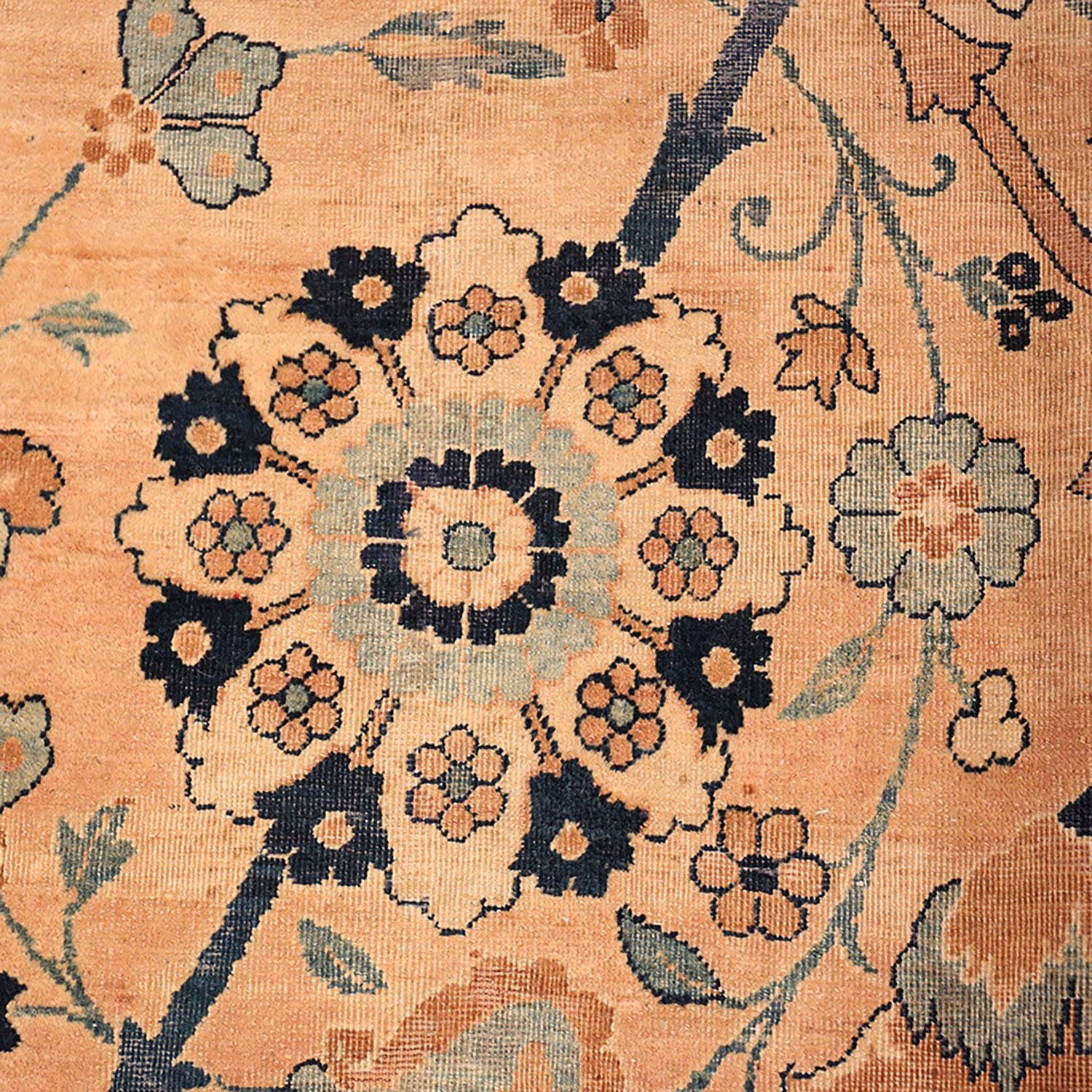 Close-up of a detailed floral-patterned carpet in classic Oriental style