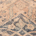 Close-up of intricate, ornate fabric pattern with interwoven threads.