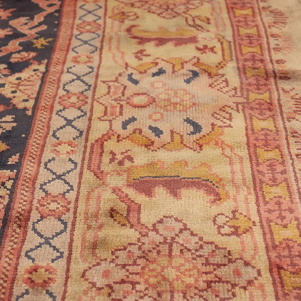 Ornate rug with traditional pattern in vibrant colors and intricate design.