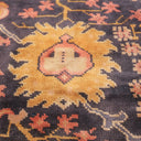 Close-up of a beautifully crafted, ornate patterned carpet in yellow and beige hues.