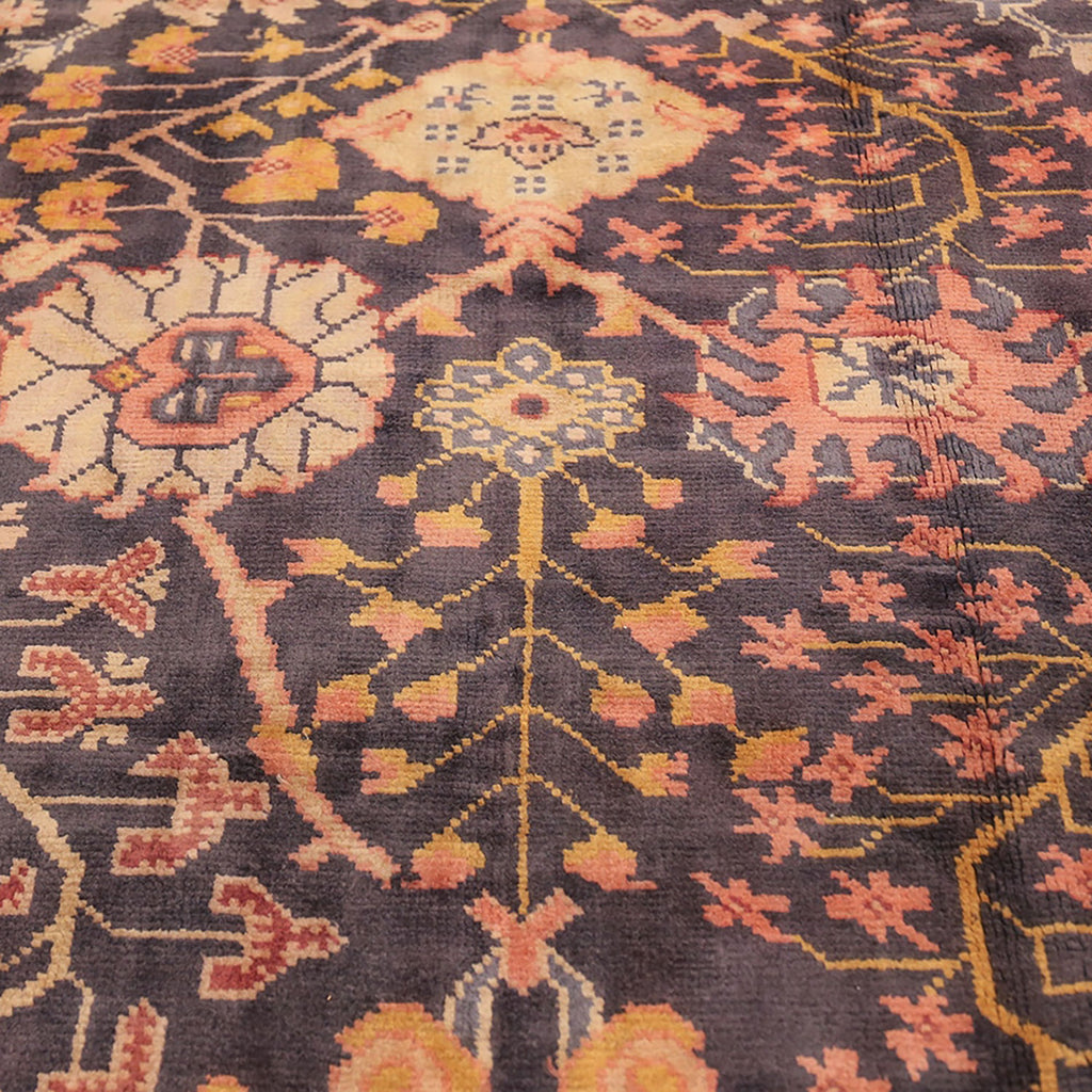 Intricately patterned handmade oriental carpet showcases vibrant colors and quality craftsmanship.